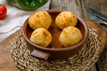 Chicken croquettes on wooden background