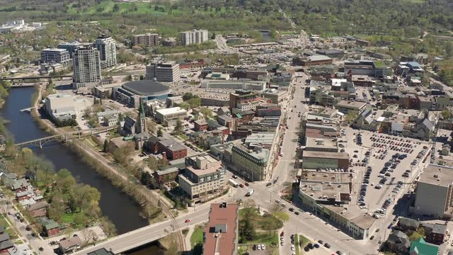 Guelph Ontario Canada 4k Aerial Drone Zoom Out of Downtown Wydnham Street and Surrounding Area, River and Cityscape. Shot Above the Main Part of City During Sunny Day
