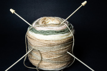 Ball of yarn and knitting needles
