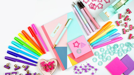 Back to school or workspace colorful stationery overhead flat lay.
