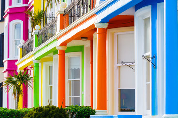 Fototapeta na wymiar Row of brightly painted multicoloured houses in Whitehead