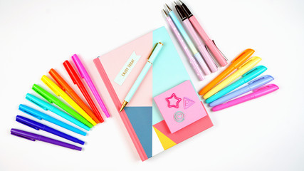 Back to school or workspace colorful stationery overhead flat lay.