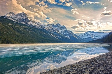 High Definition Resolution (HDR) Scenic View of Beautiful Blue Glacier Lake and Clouds Reflection in Calm Water Surface, Banff National Park, Canadian Rocky Mountains