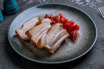 Pork ribs fried on grey concrete