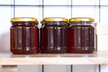 Jars of jam on the shelf in the store