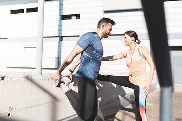 Latin Couple Stretching Together Outdoors.