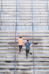Fototapeta premium Hispanic Couple Running or Jogging Together Outdoors.