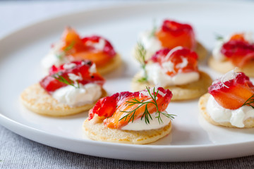 Party blinis with beetroot cured salmon, cream and horseradish 