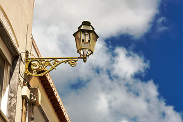 Fototapeta na wymiar Old street lanter on blue sky background