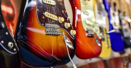 Obraz na płótnie Canvas guitars lined in a row