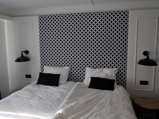 a black and white room with two beds
