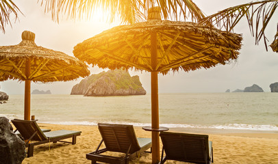 straw parasol tropical sand beach