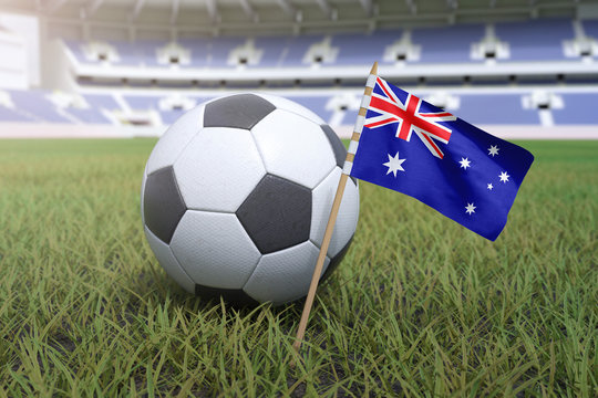 Australian flag in stadium field with soccer football - Powered by Adobe