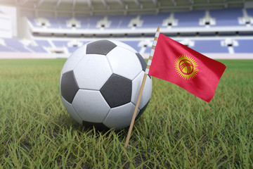 Fototapeta premium Kyrgyzstan flag in stadium field with soccer football