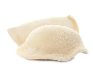 Raw dumplings with tasty filling on white background