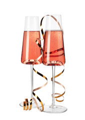 Fototapeta na wymiar Glasses of rose champagne with gold streamer isolated on white