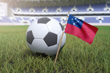 Naklejka premium Samoan flag in stadium field with soccer football