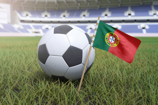 Portuguese flag in stadium field with soccer football
