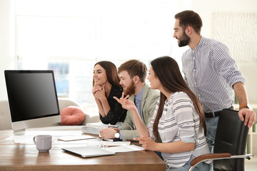 Group of colleagues using video chat on computer in office. Space for text