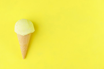 Ice-cream scoop in waffle ice cream cone on bright pink background. Summer, heat, vacation, refreshment, traditional seasonal cold sweets