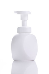 white plastic bottle with pump dispenser on white background, push the pump for hand foam, liquid soap, shampoo or lotion for health and beauty