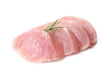 Cut raw turkey fillet with rosemary on white background