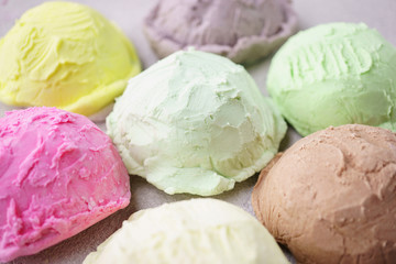 Summer background. Set of various flavored ice cream scoops on stone table, copy space. Refreshment, traditional seasonal cold sweets