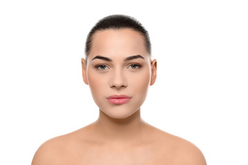 Obraz premium Portrait of young woman with beautiful face and natural makeup on white background