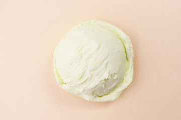 Ice-cream scoop on pastel background, copy space. Summer vacation, refreshment, traditional seasonal cold sweets