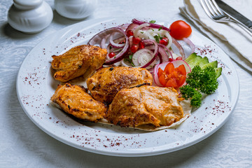 chicken kebab on white plate
