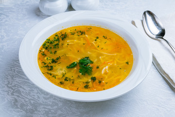 Chicken soup bouillon in a plate