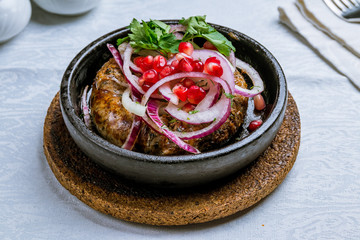 beef kupaty on board with onion