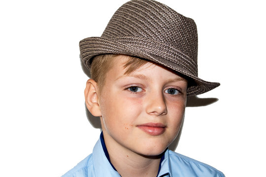 Portrait of a boy in a blue shirt and hat