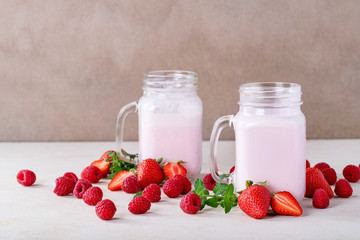 Strawberry smoothie in glass jars