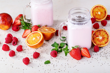 Strawberry smoothie in glass jars