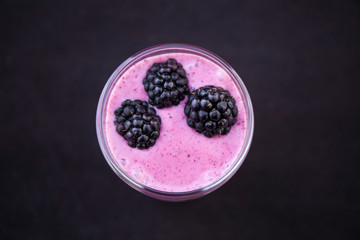 Acai Smoothie with fresh blackberries in the glass cup