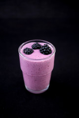 Acai Smoothie with fresh blackberries in the glass cup