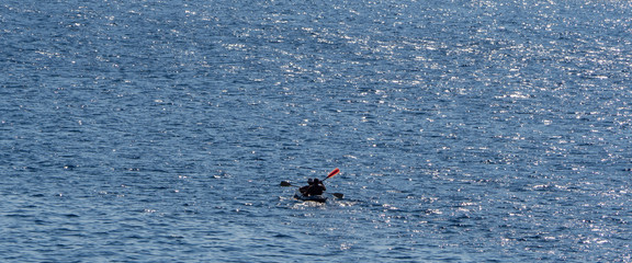 Lone kayakers on a open sea