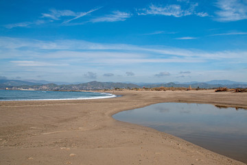 Fototapeta na wymiar Sandbar where the Pacific ocean and the Santa Clara river meet at Surfers Knoll beach in Ventura California United States