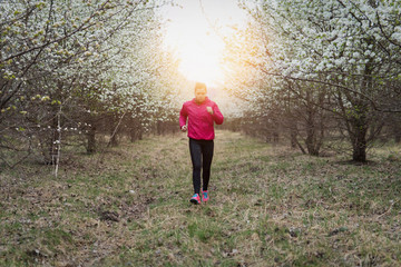Adult woman doing workout in the park.