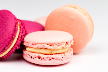 Stack of French pink and fuchsia macarons or macaroons, side closeup.