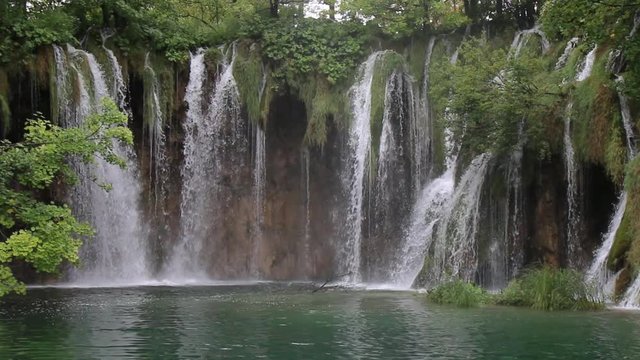 Waterfalls in Slovenia spill into the lake 1080p  25fps