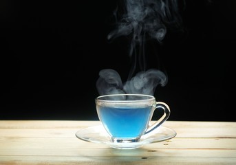 hot tea cup in a glass on wood table. Hot drink . Copy space.