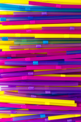 Set of colorful tubes for cocktails. Parallel and perpendicular lie on a white background.