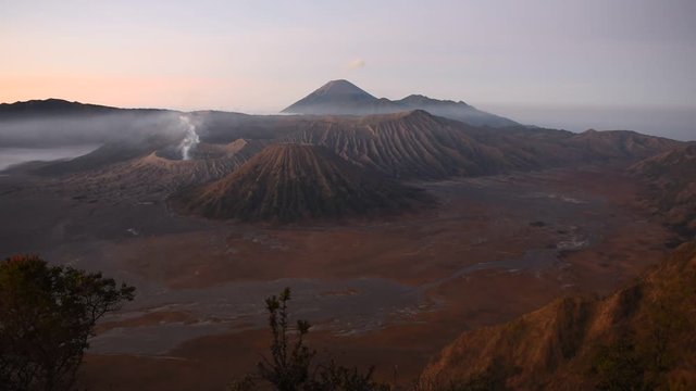 Mount Bromo vulcano in Indonesia. Admiring the view at sunrise.