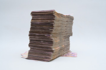 Money on white backdrop. Big pile of Argentinian pesos