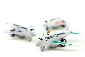 Miniature people : with airplane ,Transportation, traveling or business trip concepts.