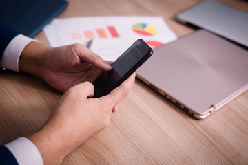 Businessman serching data with smartphone between meeting  corporate success brainstorming