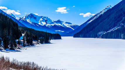 Frozen Duffey Lake and the snow capped peaks around  lake. Mount Rohr at the south end of the lake along Highway 99 between Pemberton and Lillooet, British Columbia