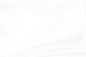 Obraz premium Gładka elegancka biała jedwabna lub satynowa luksusowa tkanina tekstura jako tło ślubne, abstrakcyjne tło białej tkaniny z miękkimi falami.